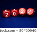 Dice with new year 2022 on blue background 80400040