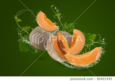 Water splashing on whole and slice of orange japanese melons or cantaloupe melon with seeds isolated on green background Water splashing on whole and slice of orange japanese melons or cantaloupe melon with seeds isolated on green background 80401495