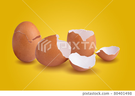 Empty broken chicken eggshell on yellow background 80401498