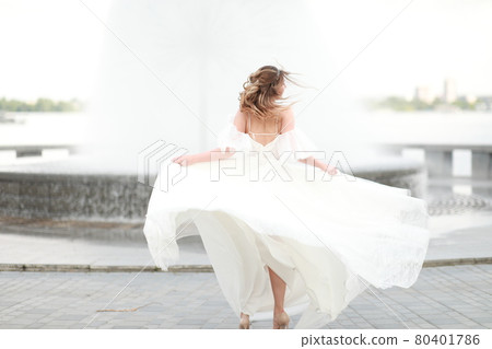 A person standing in front of water 80401786