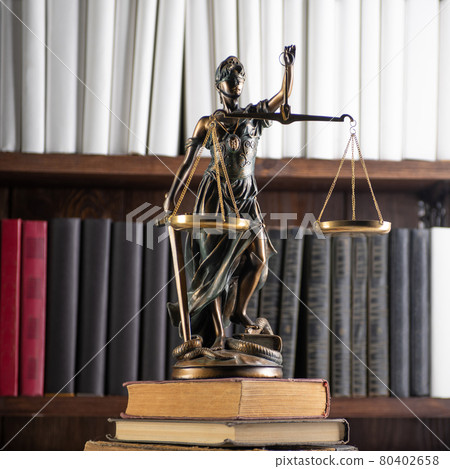 Scales of Justice, Lady Justice, law library concept, Law books in the background. 80402658