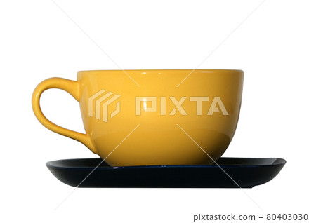Large yellow cup and black saucer isolated on white 80403030