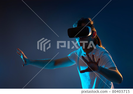 Young man using virtual reality headset. VR gadgets 80403715
