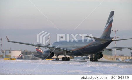Aeroflot aircraft A330 taxiing in Moscow airport, winter view Aeroflot aircraft A330 taxiing in Moscow airport, winter view 80404889