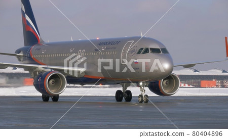 Winter view of taxiing aircraft A320 of Aeroflot at Sheremetyevo Airport, Moscow Winter view of taxiing aircraft A320 of Aeroflot at Sheremetyevo Airport, Moscow 80404896