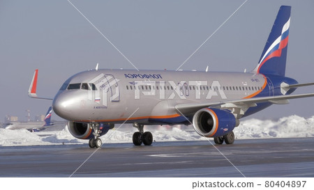 Aeroflot aircraft Airbus A320 on tarmac at the airport, winter view Aeroflot aircraft Airbus A320 on tarmac at the airport, winter view 80404897