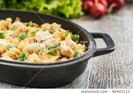 Pilaf rice-curry with chicken and salad in the form of iron Pilaf rice-curry with chicken and salad in the form of iron 80405212
