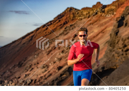 Trail runner on mountain run. Athlete man focused running training endurance. Fitness motivation. Trail runner on mountain run. Athlete man focused running training endurance. Fitness motivation. 80405250
