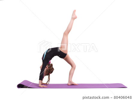 Cute child girl making Gymnastic exercises against white. 80406048