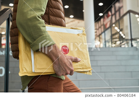 Delivery Man Holding Parcels Close Up Delivery Man Holding Parcels Close Up 80406184