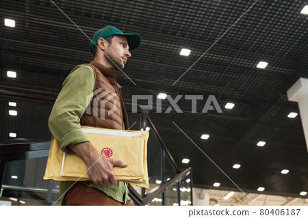Delivery Man Holding Parcels Side View Delivery Man Holding Parcels Side View 80406187