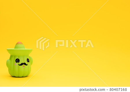 Toy cactus in sombrero on yellow background with copy space. Toy cactus in sombrero on yellow background with copy space. 80407168