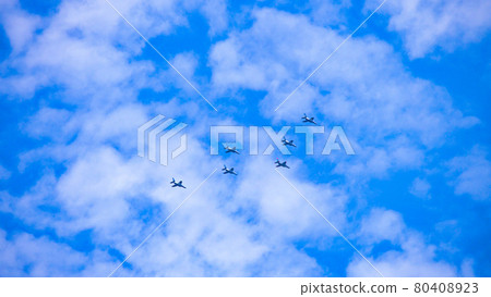 Formation of planes flying in the distant sky Formation of planes flying in the distant sky 80408923