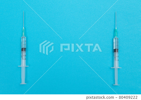 Several Syringe on Blue Table Several Syringe on Blue Table 80409222