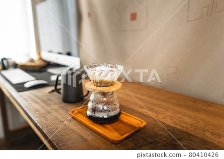 Pouring a hot water over a drip coffee Pouring a hot water over a drip coffee 80410426