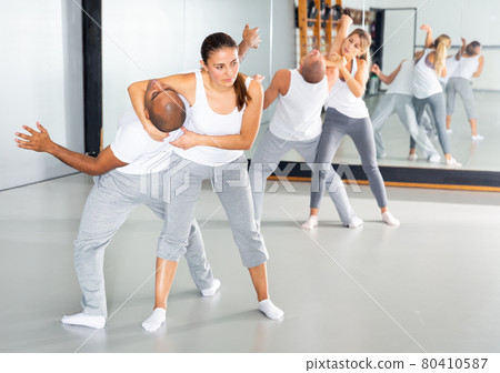 Woman doing strength techniques in self defense training 80410587