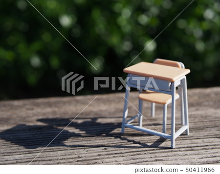 Desks and chairs on green and wooden floors 80411966