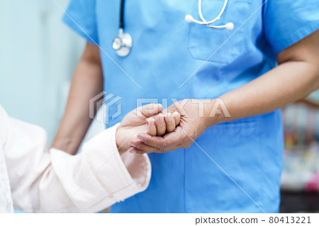 Holding Touching hands Asian senior or elderly old lady woman patient with love, care, helping, encourage and empathy at nursing hospital ward : healthy strong medical concept . 80413221