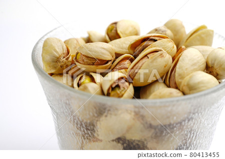 Pistachio nuts on white background : healthy food concept. Pistachio nuts on white background : healthy food concept. 80413455
