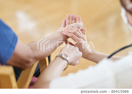 A nurse measuring the pulse of the elderly in a long-term care facility A nurse measuring the pulse of the elderly in a long-term care facility 80415066