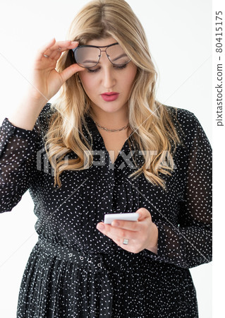 online offer surprised obese woman using phone online offer surprised obese woman using phone 80415175