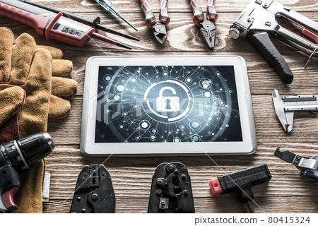 Web security and technology concept with tablet pc on wooden tab Web security and technology concept with tablet pc on wooden tab 80415324