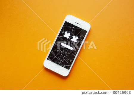 Broken smartphone with cracked destroyed screen Broken smartphone with cracked destroyed screen 80416908