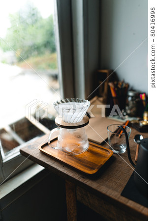 drip coffee in house,Pouring a hot water over a drip coffee drip coffee in house,Pouring a hot water over a drip coffee 80416998
