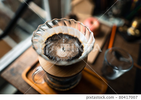 drip coffee in house,Pouring a hot water over a drip coffee 80417007