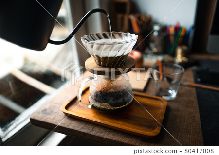 drip coffee in house,Pouring a hot water over a drip coffee 80417008