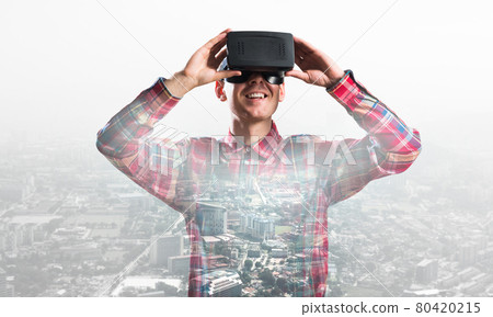 Guy wearing checked shirt and virtual mask demonstrating some emotions Guy wearing checked shirt and virtual mask demonstrating some emotions 80420215