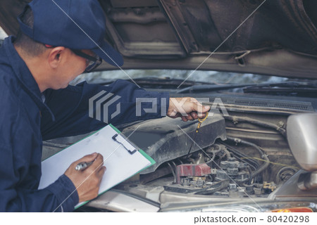 Mechanic car service auto garage in automotive mobile center. Technician workshop repair engine motor vehicles service mechanical engineering business. Automobile mechanic hands car repairs technic Mechanic car service auto garage in automotive mobile center. Technician workshop repair engine motor vehicles service mechanical engineering business. Automobile mechanic hands car repairs technic 80420298