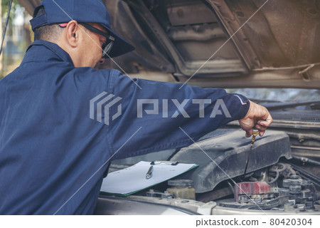 Mechanic car service auto garage in automotive mobile center. Technician workshop repair engine motor vehicles service mechanical engineering business. Automobile mechanic hands car repairs technic Mechanic car service auto garage in automotive mobile center. Technician workshop repair engine motor vehicles service mechanical engineering business. Automobile mechanic hands car repairs technic 80420304