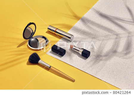 Woman's accessories lying flat on paper background. Yellow and white pastel colors with copy space around products. Woman's accessories lying flat on paper background. Yellow and white pastel colors with copy space around products. 80421264