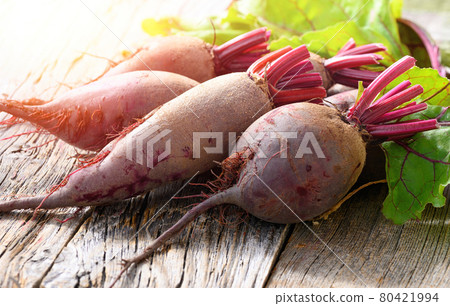 Red Beets on wooden rustic background. Organic Beetroot. 80421994