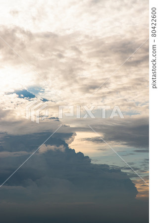 The sun shines through the clouds in the sky.  The shape of the clouds evokes imagination and creativity. They can be used as wallpapers that look amazing. 80422600