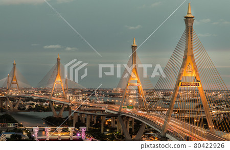 Bhumibol suspension bridge cross over Chao Phraya River at evening. Bhumibol suspension bridge cross over Chao Phraya River at evening. 80422926