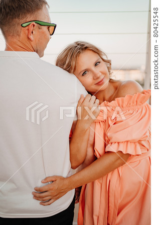 the woman rests on the man's shoulder. a happy and reliable marriage.  80425548