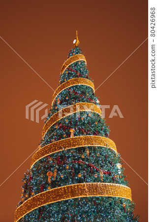 Christmas tree with ornaments, ribbons and lights Christmas tree with ornaments, ribbons and lights 80426968