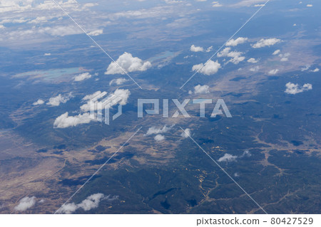 Overview of fluffy clouds in mountains from an airplane, Arizona 80427529