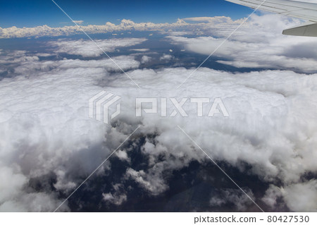 Wing aircraft in altitude during flying above the clouds 80427530