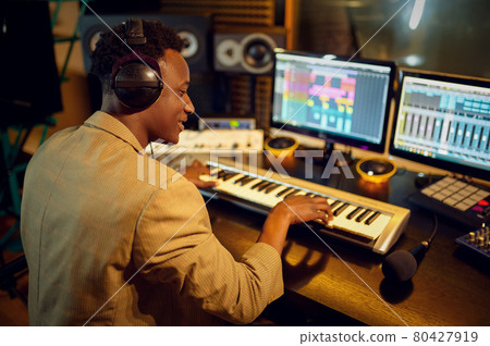 Male dj listening a record, recording studio 80427919