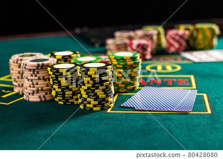 Poker chips on a poker table at the casino Poker chips on a poker table at the casino 80428080