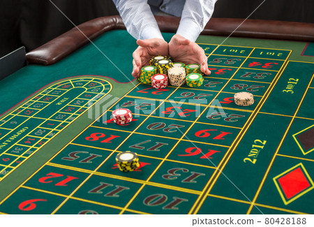 Picture of a green table and betting with chips. Picture of a green table and betting with chips. 80428188