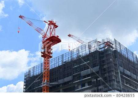 Condominium and crane under construction Condominium and crane under construction 80428655