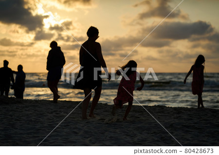 Family vacation sunset happy together at the beach  80428673