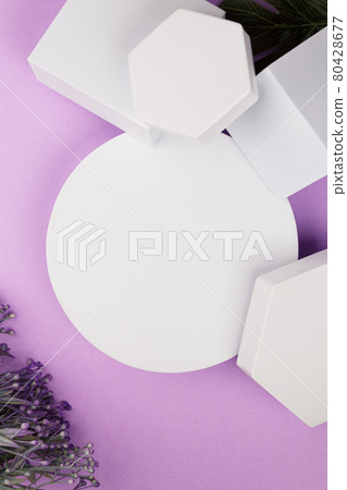 white platform with geometric shapes and flowers and monstera on a purple background 80428677