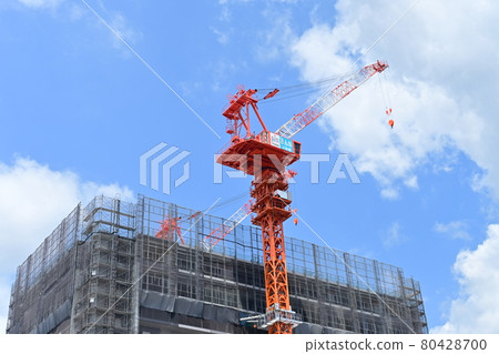 Condominium and crane under construction Condominium and crane under construction 80428700