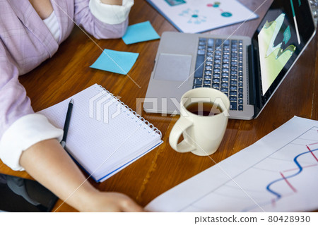 Young woman, manager working at office. Using laptop, modern gadgets. Remote working. Workplace at company, home with PC, devices. Young woman, manager working at office. Using laptop, modern gadgets. Remote working. Workplace at company, home with PC, devices. 80428930
