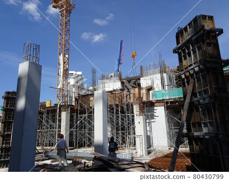 PENANG, MALAYSIA -MAY 3, 2020: Structural work is underway at the construction site. Work is carried out in stages according to the sequence of work. The workers practice standard safety methods. 80430799